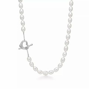 Timeless open heart Tiffany design is 18” long. Must have! Excellent condition.